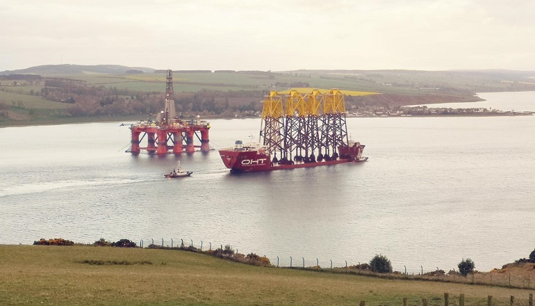 Offshore Heavy Transport's Osprey vessel arrives in the Port of Nigg with jackets that DEME will install at the Moray East offshore wind project site