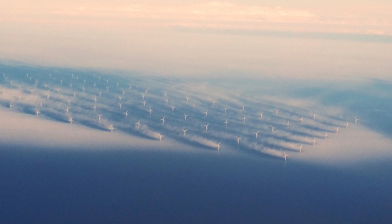 Low hanging fog creates patterns at Orsted's Horns Rev 2 offshore wind farm