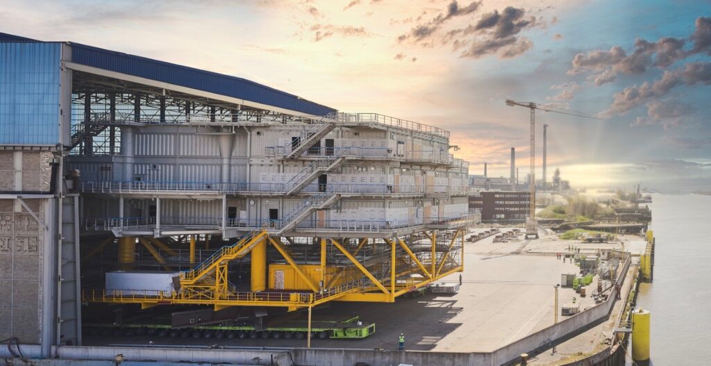 The substation for the 496MW Saint Brieuc offshore wind farm is moved out of Engie Solutions dockyard in Hoboken