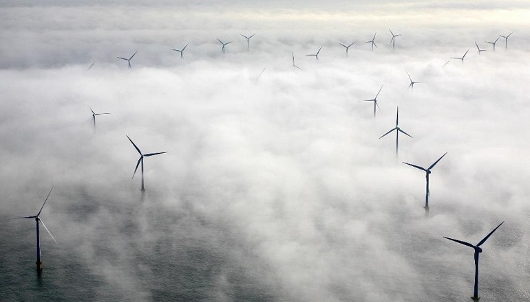 The 60MW Scroby Sands offshore wind farm emerges from the mist off the coast of Norfolk