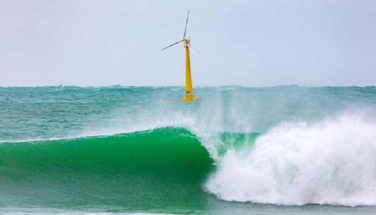 Waves rock Saitec Offshore's 1:6 scale BlueSath prototype floating wind turbine in El Abra del Sardinero off Santander