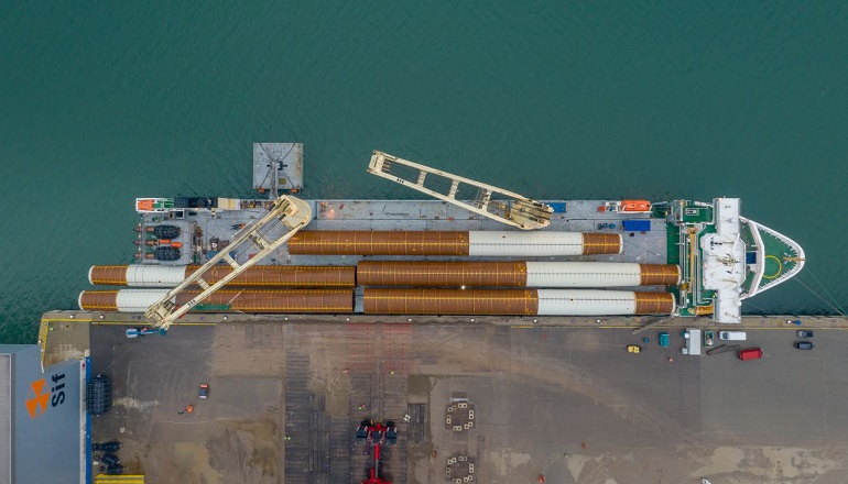 SAL Heavy Lifting's MV Lone vessel is transporting nine monopiles for the first large scale offshore wind farm in Japan